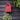 rood design vogel huisje aan zwarte schutting